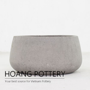 Raw cement low palm planter