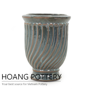 Beautiful antique tornado cup planter