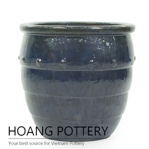 Moss green round ceramic step planter